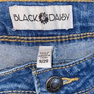Black daisy blue jeans with beautiful stitching red/pink flowers